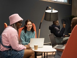 Images of students chatting at the Nook on campus