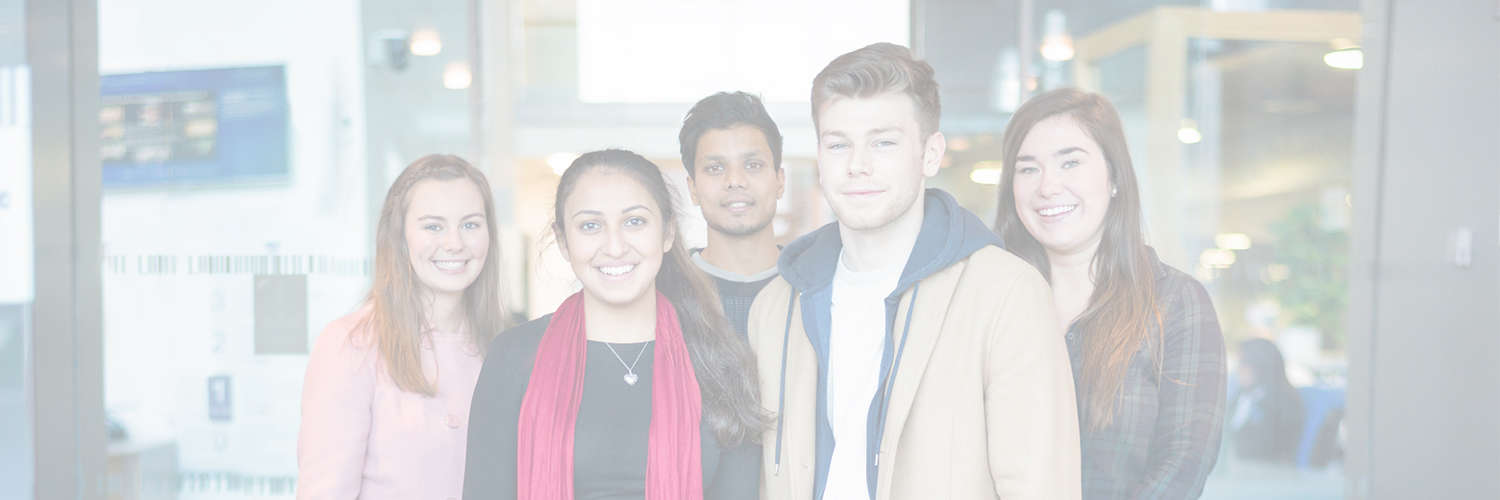 A photo of a group of QMU students looking directly at the camera and smiling