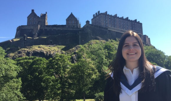 Alexia Mitchell standing next to Edinburgh Castle
