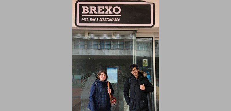 A storefront with a black and white sign titled 'Brexo' and small subtitle that states 'Fags, Tins and Scratchcards'