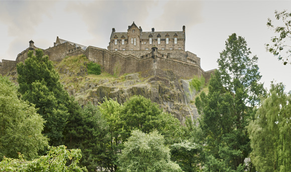 A view of Edinburgh Castle from below in Princes Street Gardens