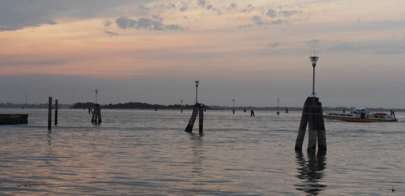 A seafront at dusk.