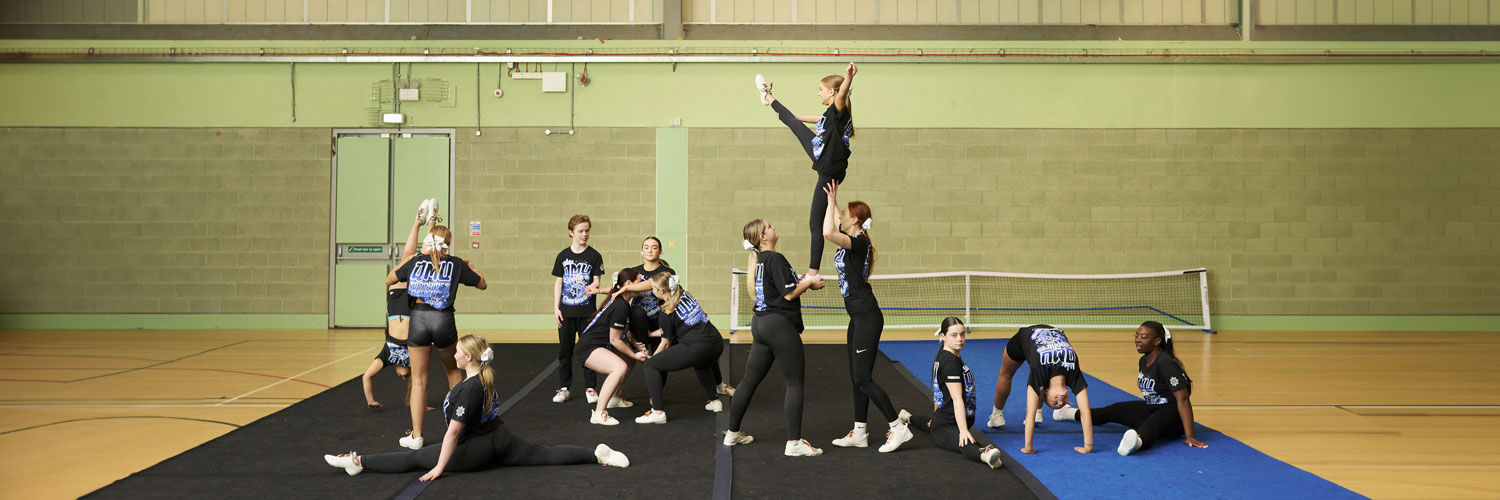 QMU Sapphires Cheerleading squad practising in the gym.