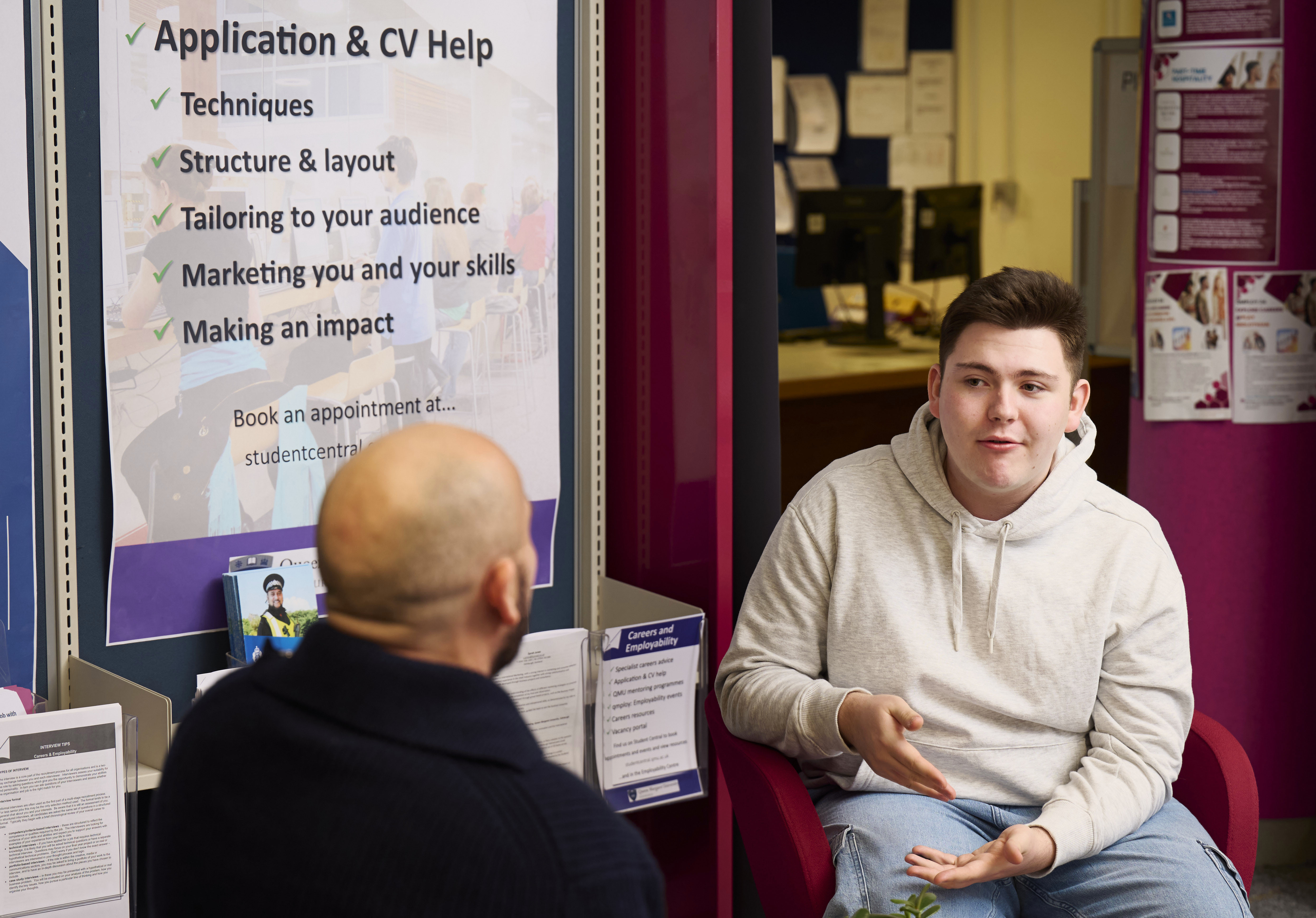 Career advisor helping male student
