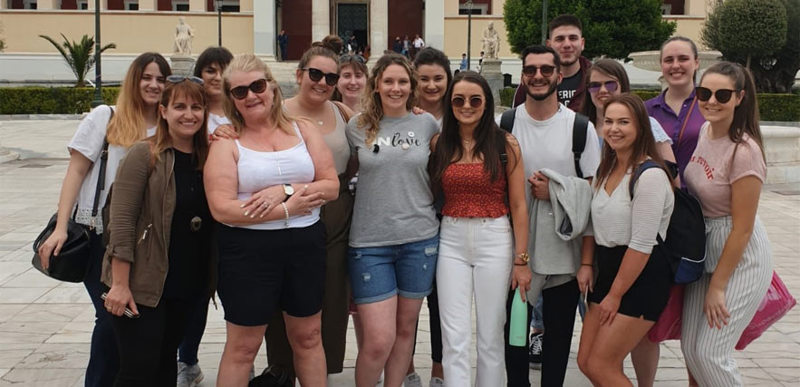 A large group of people pose for a photo together.