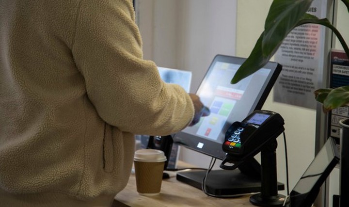 student using self scan and payment options on campus