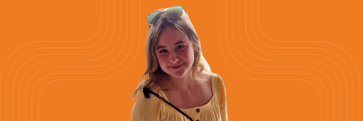 Photo of student Emese Toth with an orange background