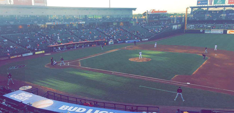 A busy game at a baseball pitch.