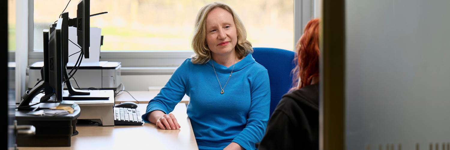 Disability advisor helping female student