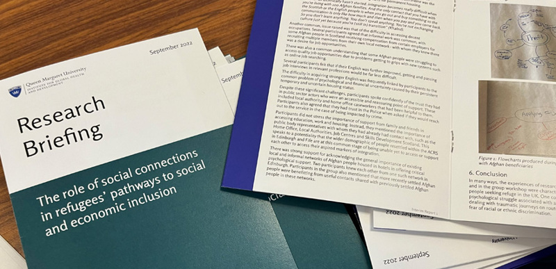 A close up of the cover and inside of a Research Briefing