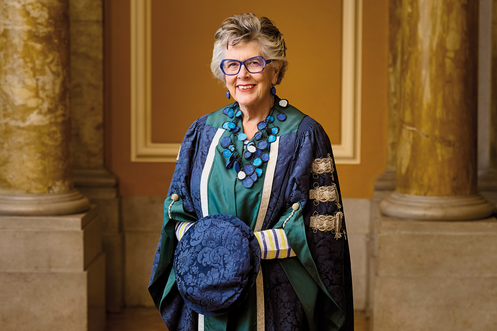 Photo of Dame Prue Leith CBE in graduation gown after recieving Honorary Degree from Queen Margaret University