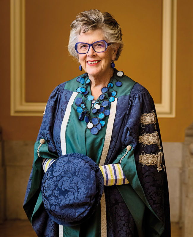 Photo of Dame Prue Leith CBE in graduation gown after recieving Honorary Degree from Queen Margaret University