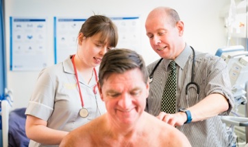 Image of Doctors examining patients back