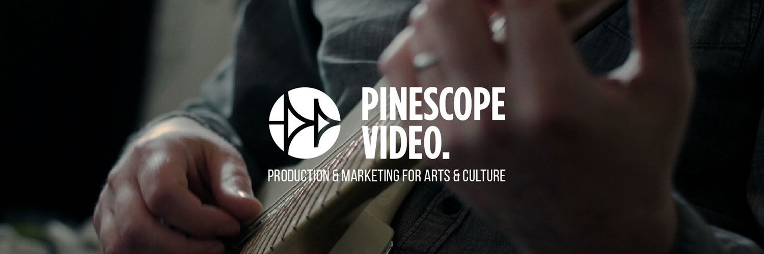 A close-up shot of someone holding a guitar, the Pinescope Video logo in the forefront with the tagline 'Production and Marketing for Arts and Culture'.