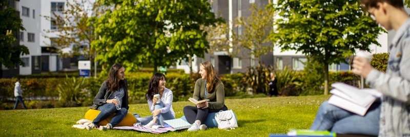 QMU students and staff relaxing in the university grounds