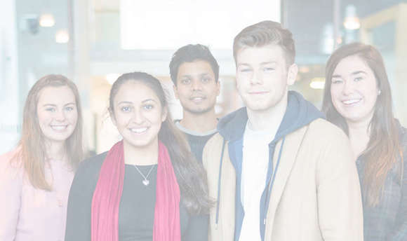 A photo of a group of QMU students looking directly at the camera and smiling