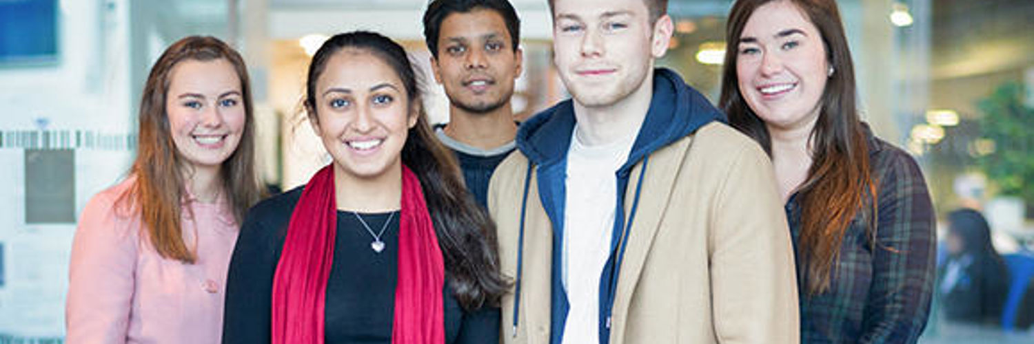 A photo of a group of QMU students looking directly at the camera and smiling