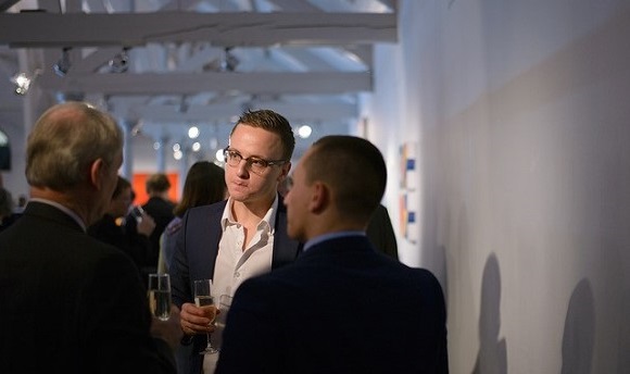 A QMU student networking with professionals at Dovecot Studio Edinburgh