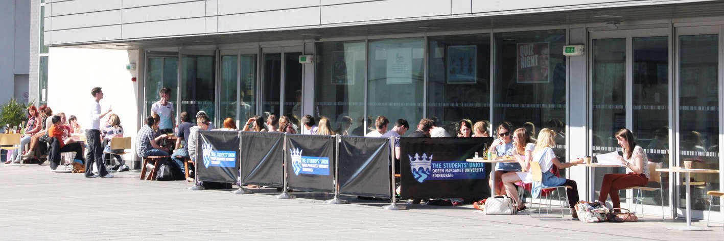 The Queen Margaret University Student Union outdoor seating area full of students