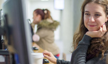 A pair of QMU students working at a computer in the Learning Resource Centre