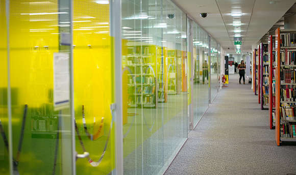 A corridor of modern study rooms at Queen Margaret University, Edinburgh