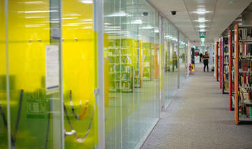 A corridor of modern study rooms at Queen Margaret University, Edinburgh