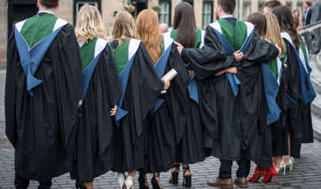 A group of posing QMU Graduates from behind