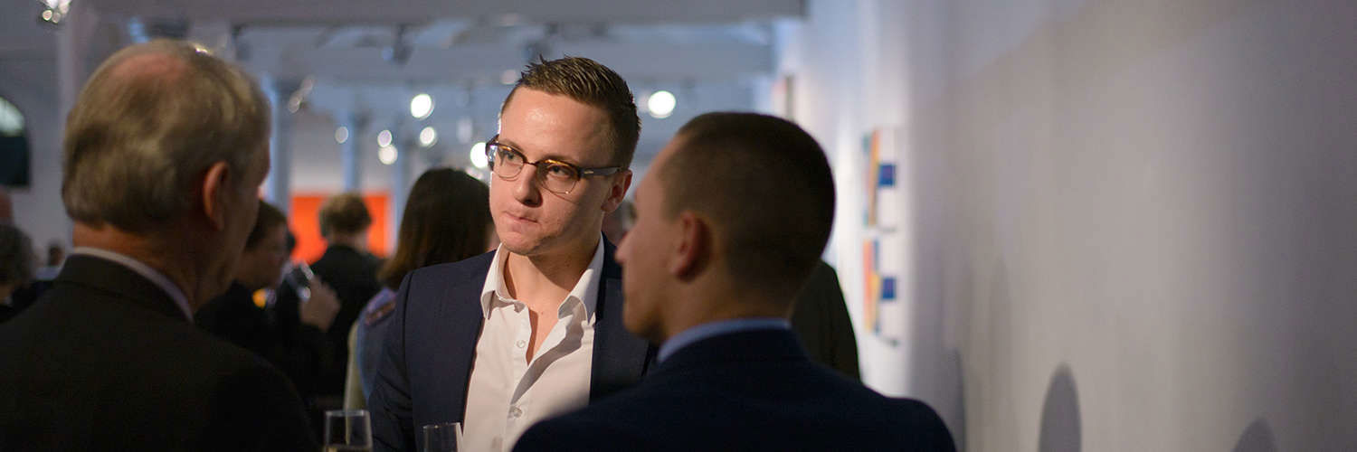 A QMU student networking with professionals at Dovecot Studio Edinburgh