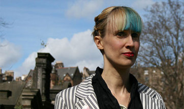 Ever Dundas close up portrait, blonde woman with dyed blue fringe