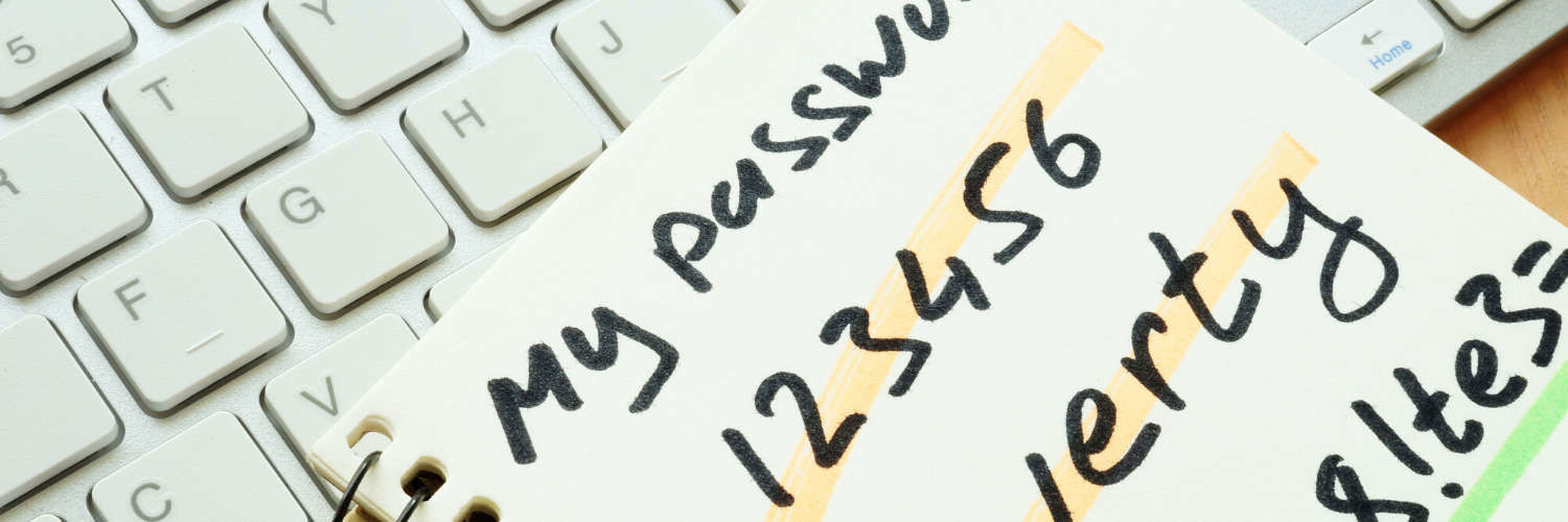 Photograph of a note pad with a generic password noted down