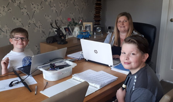 Lorain Findlay and her family sitting around a table working