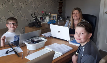 Lorain Findlay and her family sitting around a table working