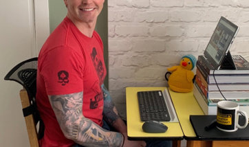 Michael Kennedy sitting at his home desk