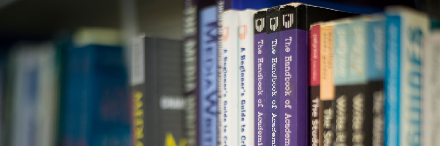 Close up of a row of books in the QMU library
