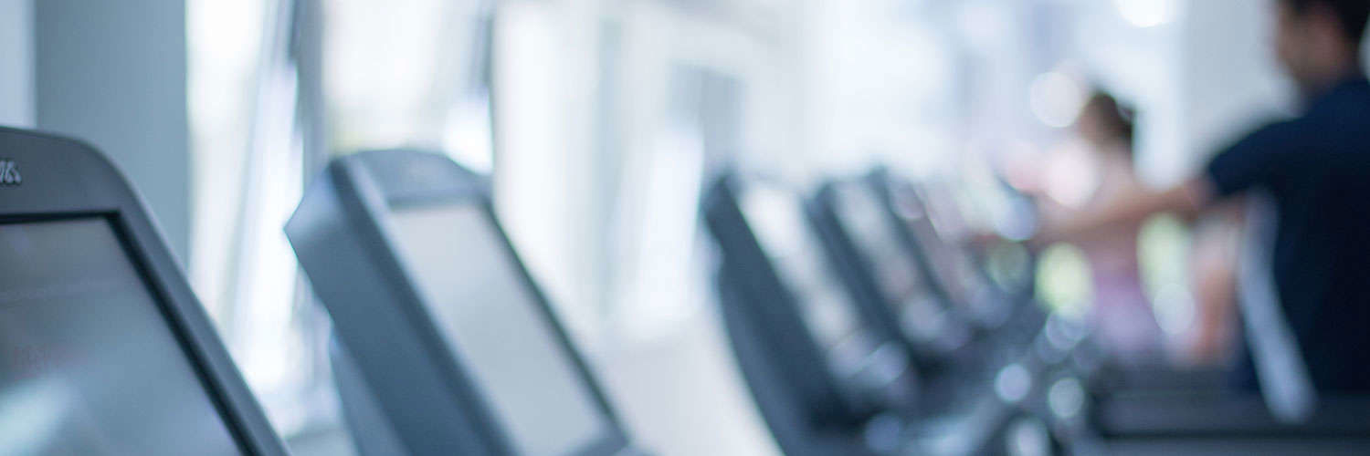 Close up of a row of treadmill screens in the sports centre, QMU