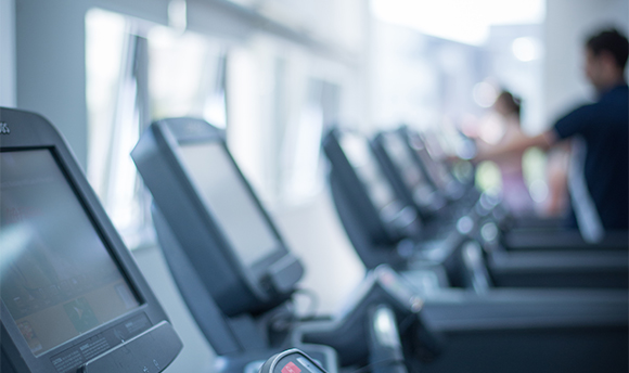 Close up of a row of treadmill screens in the sports centre, QMU