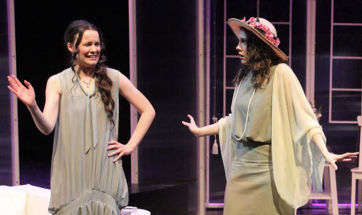 Two Queen Margaret University students acting on stage
