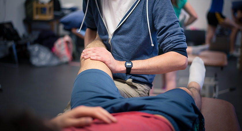 QMU physiotherapy student treating a patient