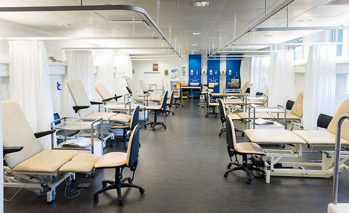 A specialist podiatry lab at Queen Margaret University, with beds, chairs and sinks
