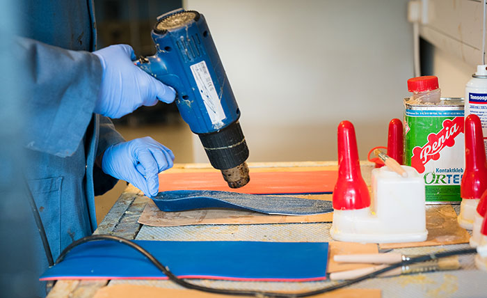 A shoe insole being made