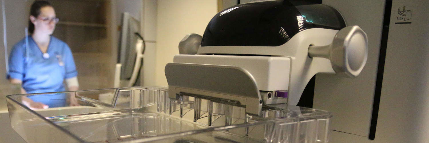A Queen Margaret University student in a clinical lab