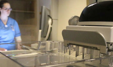 A Queen Margaret University student in a clinical lab