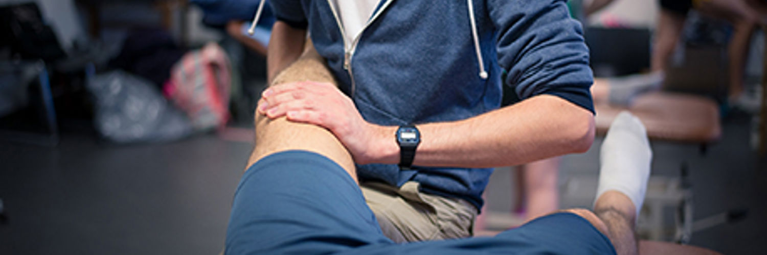 QMU physiotherapy student treating a patient