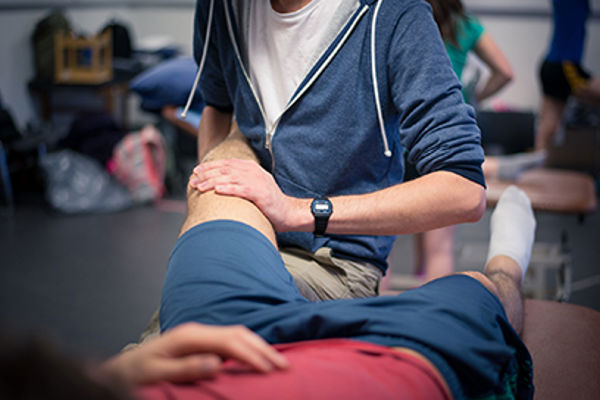QMU physiotherapy student treating a patient