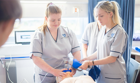 QMU Nursing Students Practice giving oxygen to a Resusci Annie doll