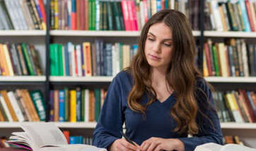 Queen Margaret University student studying in the library