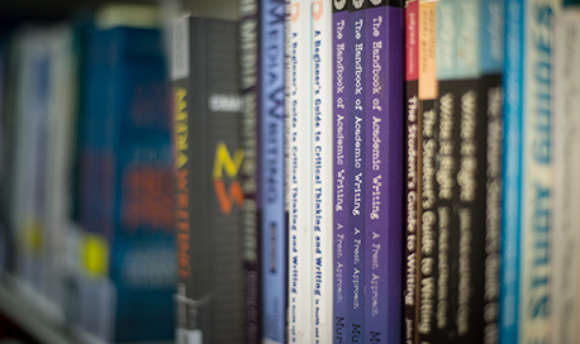 Close up of a row of books in the QMU library