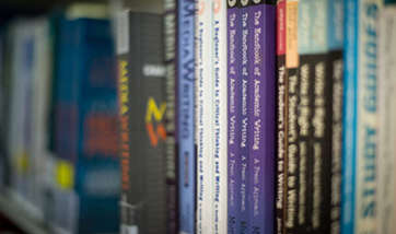 Close up of a row of books in the QMU library