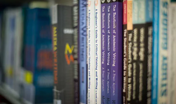 Close up of a row of books in the QMU library