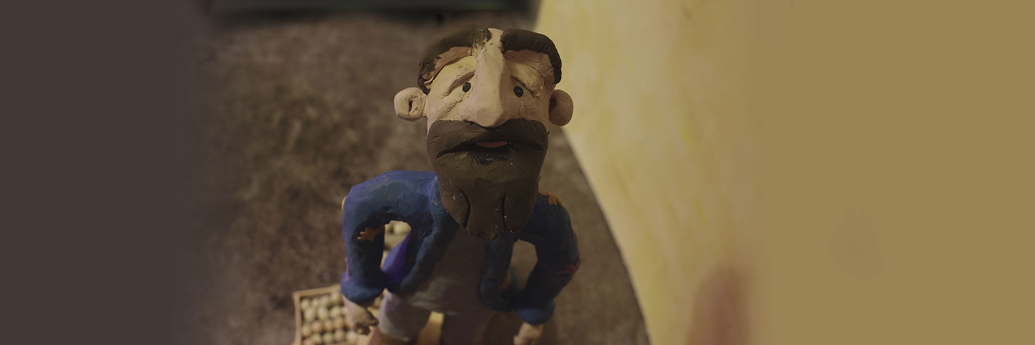 A clay figurine of a bearded character